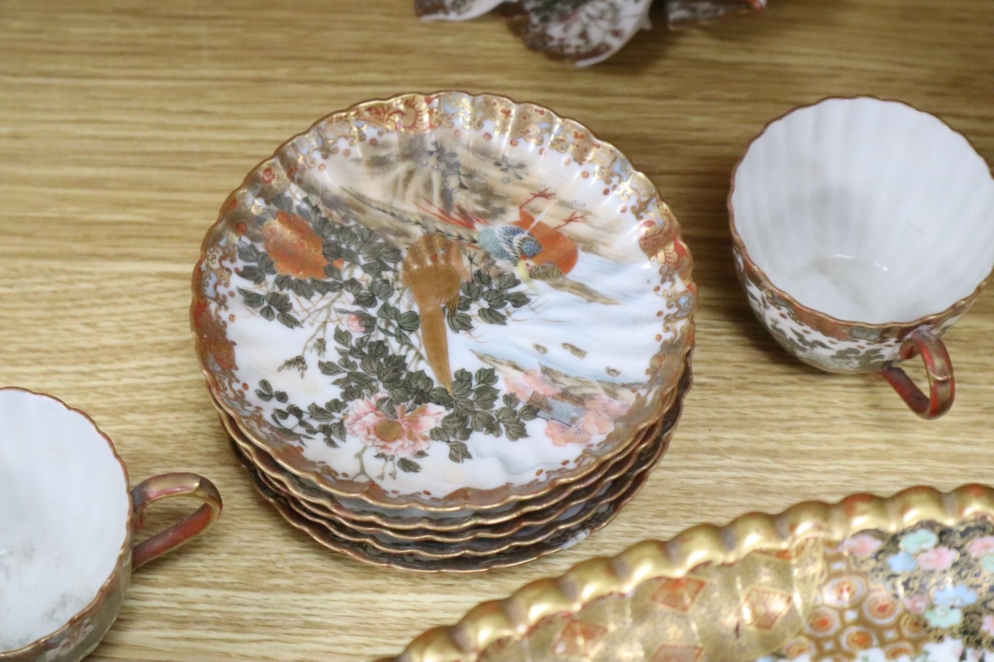 A Kutani part coffee service, with tazza tray base, largest diameter 45cm